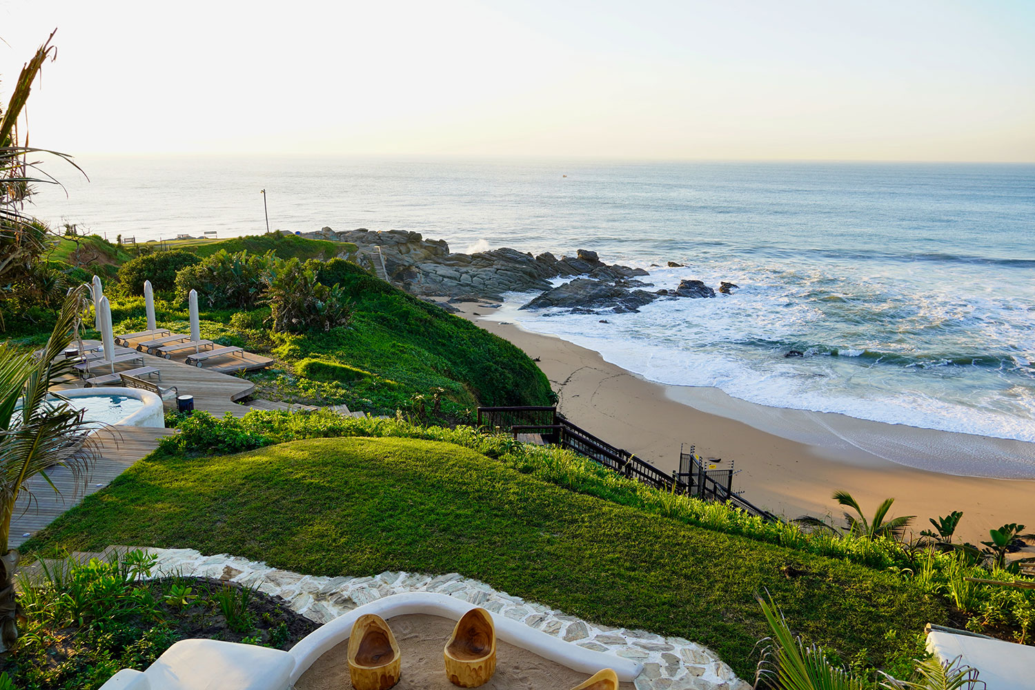 Ocean-view lawn and pool at Sala Beach House
